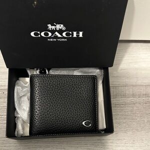 Coach Black Pebbled Leather Billfold Wallet with Detachable Chain.